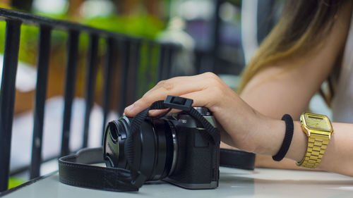 Close-up of woman photographing camera