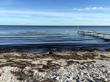 Pier over sea against sky