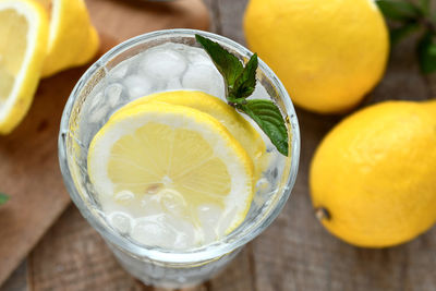 Close-up of lemon in glass on table