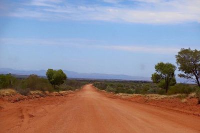 Empty road passing through landscape