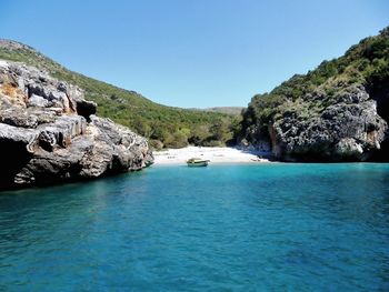 Scenic view of sea against clear blue sky