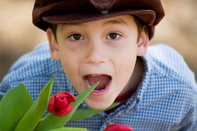 Close-up portrait of boy eating