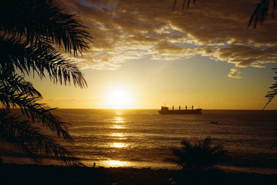 Scenic view of sea against sky at sunset