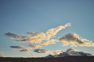 Low angle view of mountains against sky during sunset