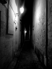 Narrow walkway at night