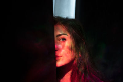 Portrait of young woman looking away