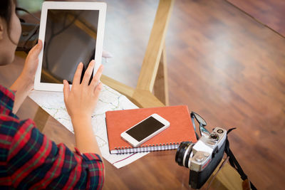 High angle view of person using laptop on table