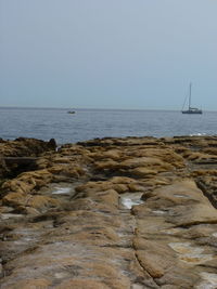 Scenic view of sea against clear sky