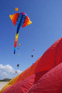 Low angle view of kite flying in sky