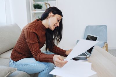 Young woman using laptop at home