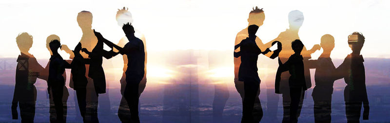 Multiple exposure image of silhouette family standing against sky during sunset