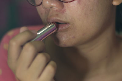 Close-up portrait of woman eating