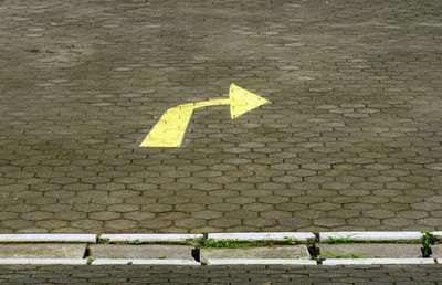 Arrow sign on road