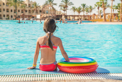 Side view of woman in swimming pool