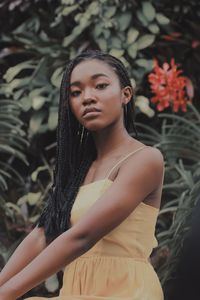 Close-up portrait of beautiful young woman standing outdoors