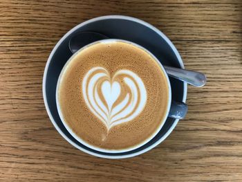 High angle view of cappuccino on table