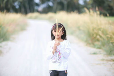 Girl wearing sunglasses standing outdoors