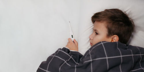 Boy holding syringe