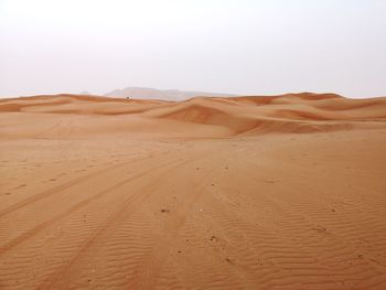 Scenic view of desert against clear sky