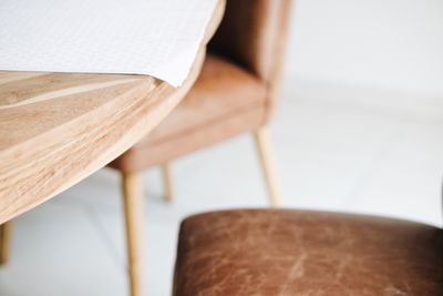 High angle view of dining table with leather chairs