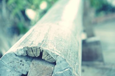 Close-up of metal container on wood