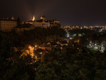 High angle view of illuminated buildings in city at night