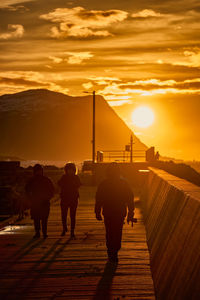 Sunset walk on the pier at flø, ulsteinvik, norway.