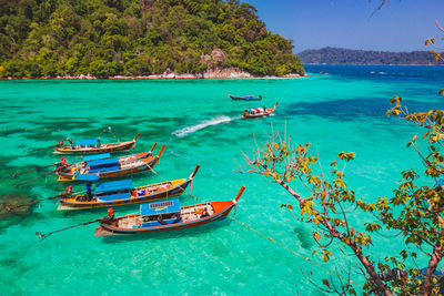 Boats moored in sea