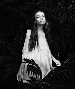 Close-up portrait of young woman standing outdoors