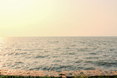 Scenic view of sea against clear sky during sunset