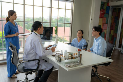 Portrait of young woman working in office