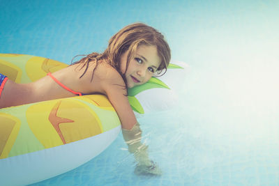 Portrait of girl swimming in pool