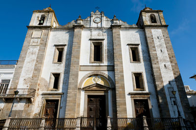 Low angle view of building against blue sky