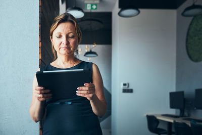 Young woman using digital tablet