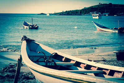 Boats moored in sea