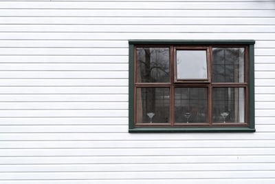 Full frame shot of window on white wall of building