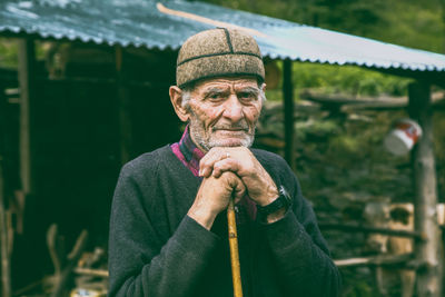 Portrait of an old man wearing a georgian svan national hat