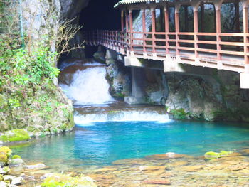 Scenic view of sea against rock formation