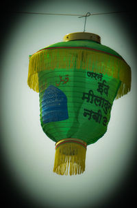 Low angle view of information sign against wall