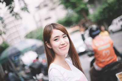 Portrait of smiling young woman outdoors