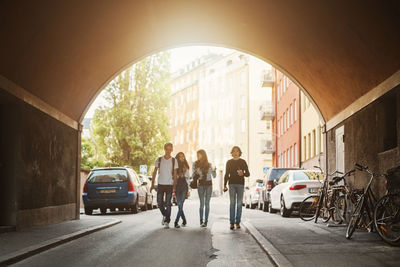 Teenagers walking in tunnel