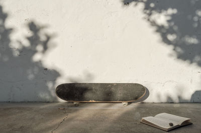 Close-up of skateboard on wall