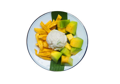 High angle view of fruits in bowl against white background