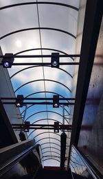 Low angle view of illuminated skylight in building