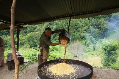 Man working by wheat processing