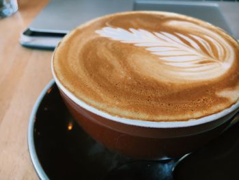 High angle view of cappuccino on table