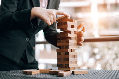 Close-up of man playing with toy on table