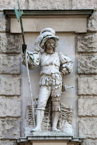 Anton schmidgruber statue against wall at kunsthistorisches museum