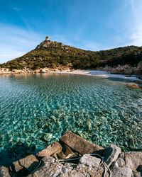 Scenic view of beach against blue sky