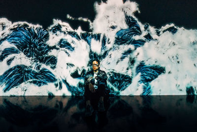 Portrait of man standing against sky